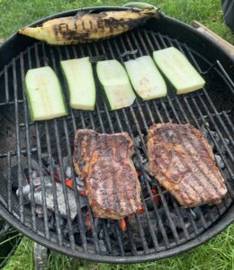 Steak and vegetables grilling